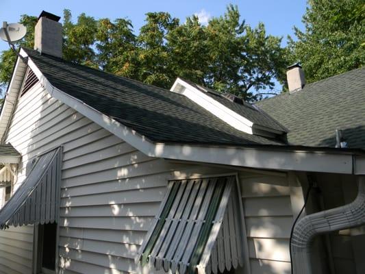 AFTER: Timberline HD Shingles in Forest Green, and Solar-Powered Roof Vent.