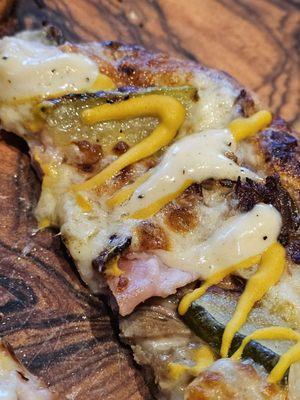 Close-up of the Cuban Pizza with the wood dish.