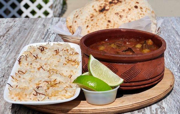 Tagen Okra with Lamb served with Egyptian bread and Egyptian rice.