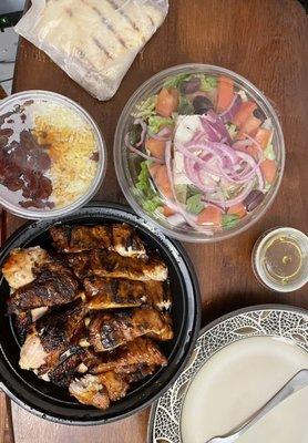 Chicken/rib combo, rice and beans, Greek Salad, and Pita bread. All delicious beyond belief!