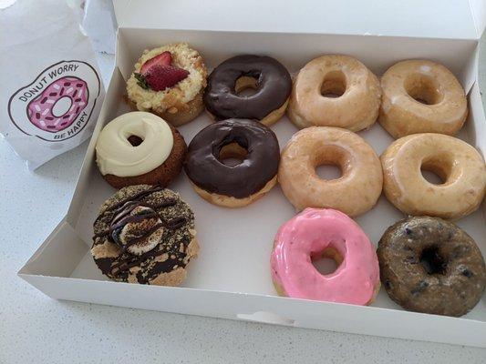 Strawberry Cream Cheese, chocolate frosted (2), glazed (4), pumpkin cream cheese, s'mores, strawberry frosted, blueberry glazed.