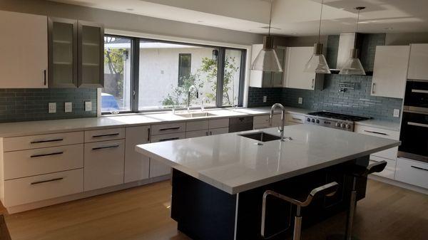 High gloss acrylic cabinets with quartz counters