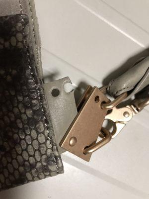 Broken hardware on the handbag