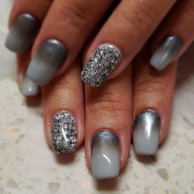 Speckled polish and silver pigment.