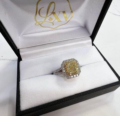 Custom made radiant cut yellow diamond engagement ring with white diamond halo and shank! Truly stunning