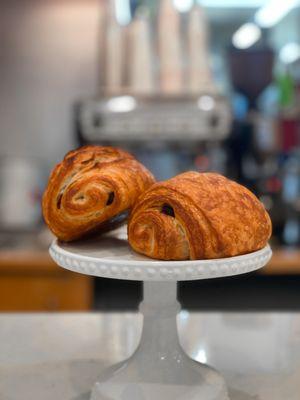 Exquisite pain au chocolat: layers of buttery pastry hugging rich chocolate. A French delight that promises pure indulgence in every bite.