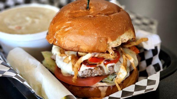 Zebra Burger; 1/2 lb Beef Patty, pepper jack, lettuce, tomatoes, marinated jalapenos, grilled bell peppers, fried shallots, chipotle sauce,