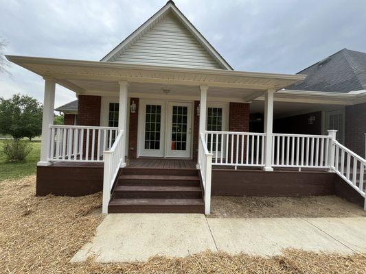 Beautiful new addition for this home owner.  New vinyl hand rails, new deck, doors and windows.