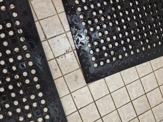 Mildew on men's shower floor