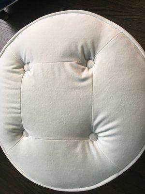 Uneven puckering by buttons on ottoman