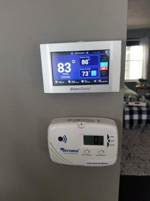 wifi enabled thermostat properly controling their new system and a low level carbon monoxide detector to ensure they're safe