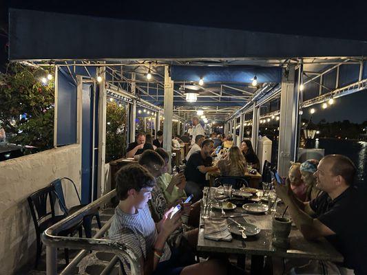 Patio seating at night. So pretty.