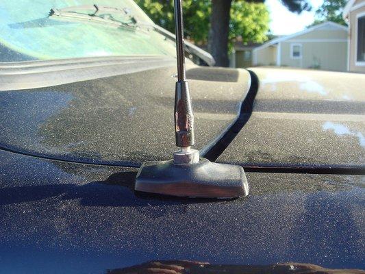 Scratched up antenna not installed correctly, uneven gap because the hood was never aligned, and wipers will not go all the way down.