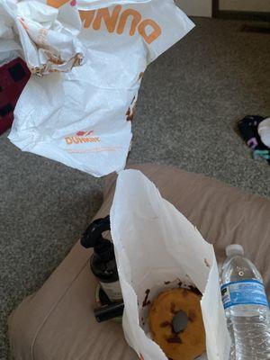 looks like they slid the donut across the ground then threw it in the bag with napkins. wtf