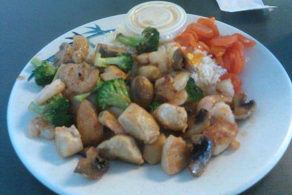 Chicken, Shirmp and broccoli, carrots, rice and shrimp sauce.