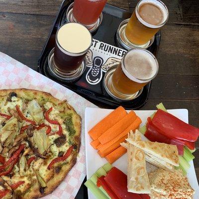 Pizza, hummus plate and beer sampler