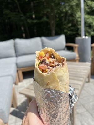 Chicken burrito with guac Rice and beans .