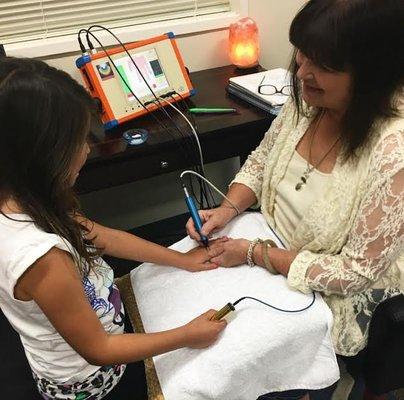 Our Certified Biontology Practitioner, Kathy, is also a Registered Nurse. Here she is working with one of our youngest clients!