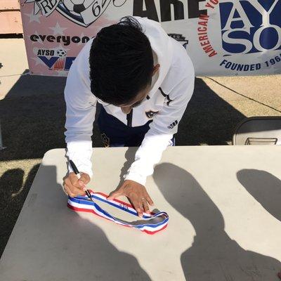 AYSO end of the season celebration - Galaxy player A. J. DelaGarza signing autographs and posing for pictures