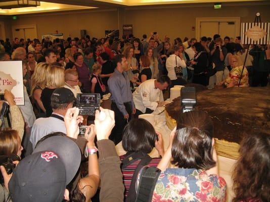 The cake cutting ceremony around 1:30 PM.  Still packed in that tiny room.