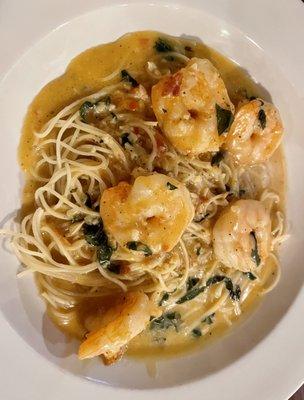 Shrimp scampi over capellini.