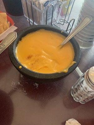 Queso - just liquid cheese dip like at sports arenas