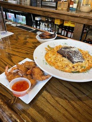 Coconut shrimp and the Rasta Pasta. Pasta is spicy, but awesome!