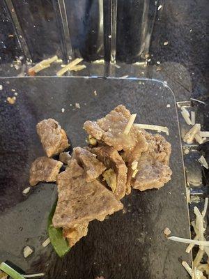 We ordered a salad with steak added, and this is the "steak" that was layered throughout the salad.