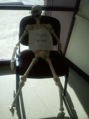 Halloween decor. Apparently he is still waiting for Dr. Crum. :)