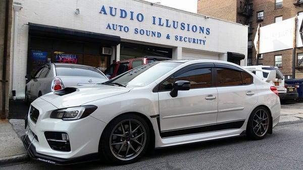 Subaru STI back for more vinyl wraps - Avery Dennison Supreme Vinyl Wrap Black Gloss accents on bottom doors