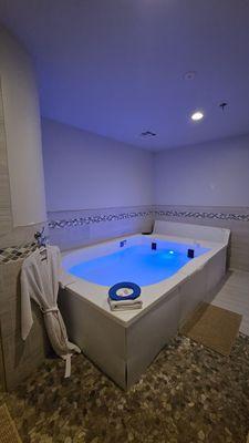 Open float tub. Shower is to the left in the room.