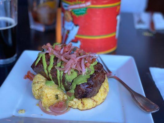 Flat iron steak for $30. Goat cheese polenta with chimichurri sauce and pickled onions and tomato garnish.