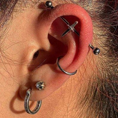 BVLA's white gold, "Slasher Dagger" on this industrial piercing by Megan.