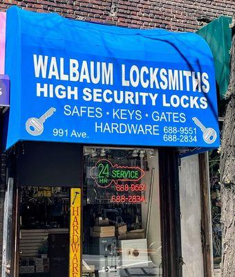 Our bright blue awning sign at 991 1st Ave.