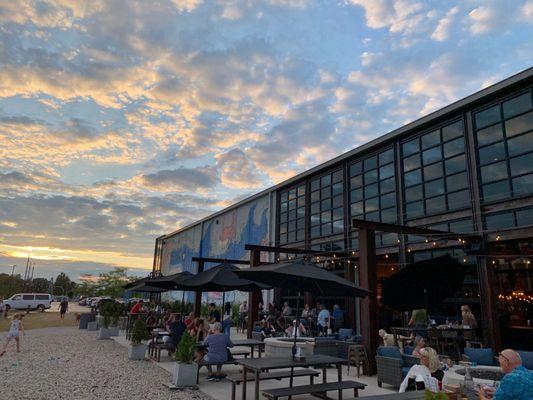 The garage doors were open and the patio was full.