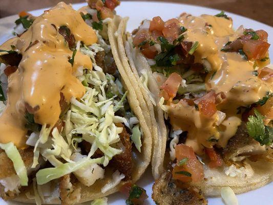 Fish tacos with tomato salsa and sauce. Really good size soft tortillas and love the cube size cut pieces of fish.