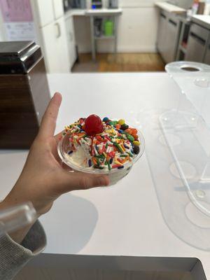 1 scoop ice cream with toppings.