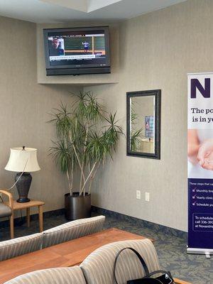 View of the television and seating in the waiting area of Novant Health WomanCare in Winston-Salem, NC