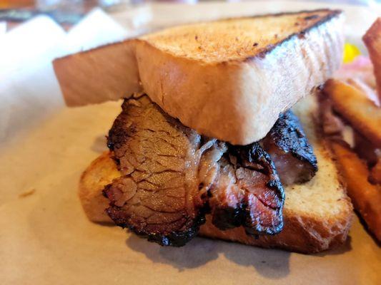 Sliced Brisket Sandwich and Fries