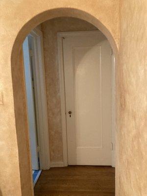 Need a door and molding installed in this archway. Door to match existing door shown