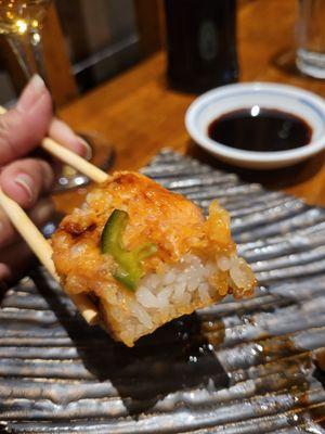 Inside of Crispy Rice topped with spicy salmon. Must try.