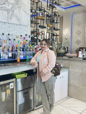 This is my niece in front of some of their selection of drinks