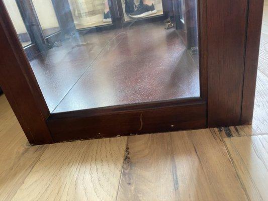 Top portion of the China cabinet that they tilted on the ground and scratched all up