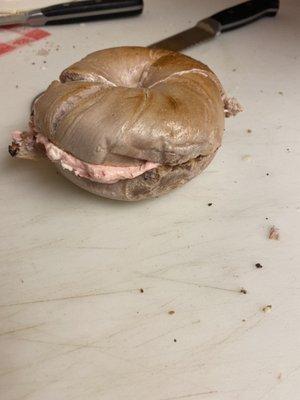 Blueberry bagel with strawberry cream cheese.