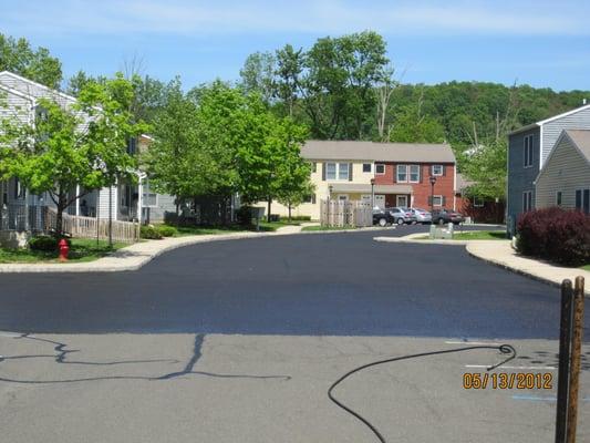 Sealcoating Parking lot and Filled cracks, then line striped it.