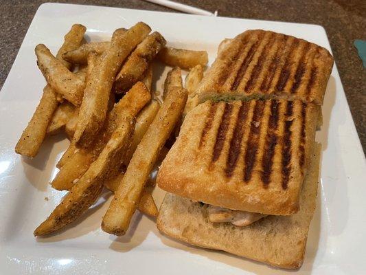 chicken and pesto panini with a side of truffle parmesan fries