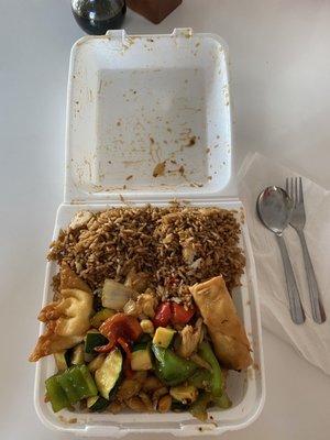 Kung pao chicken combo served in to-go box while dining inside