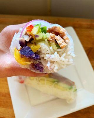 side order of vegan spring rolls - organic english cucumbers, sweet bell peppers, ube, red onions, lettuce, and rice noodles!