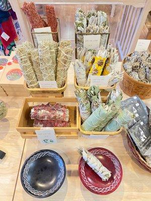 Sage bundles with different blends of dried flowers and herbs.