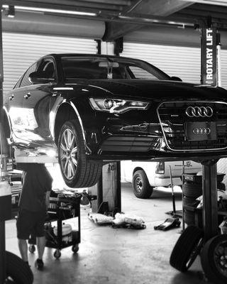 Black & White shot of the Audi getting brakes replaced